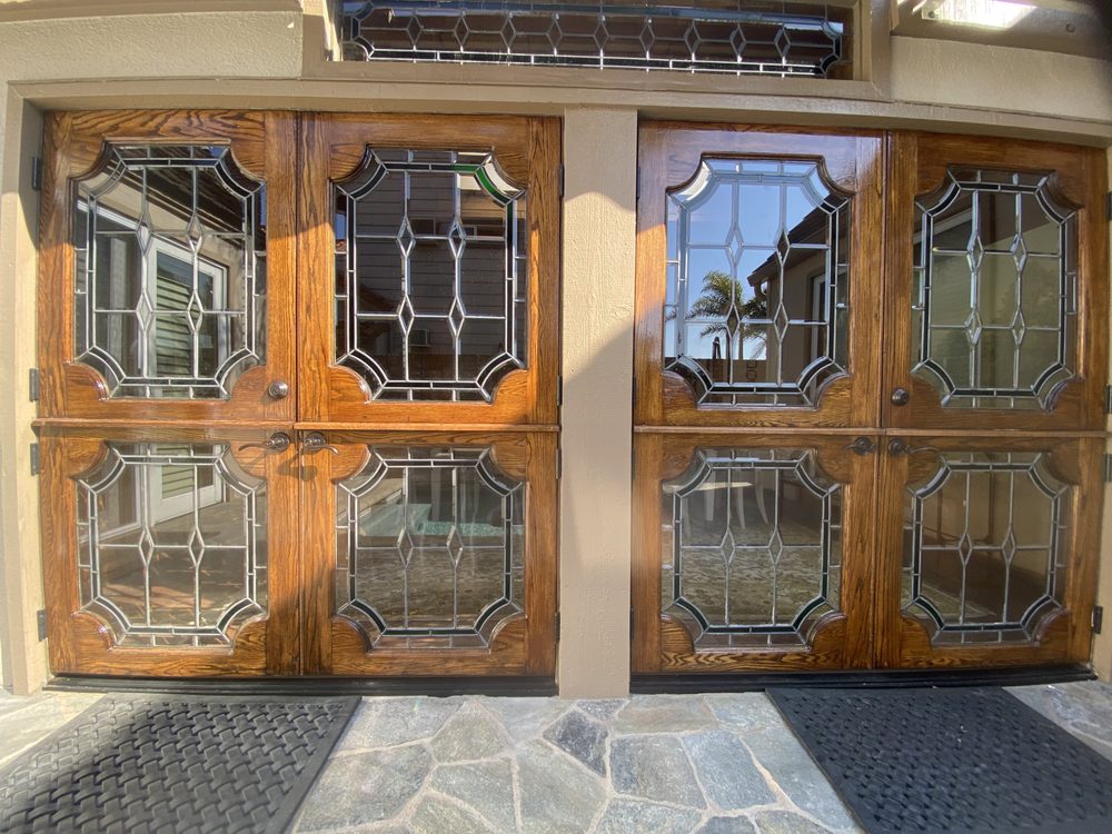 Pair of oak double Dutch doors with leaded beveled glass