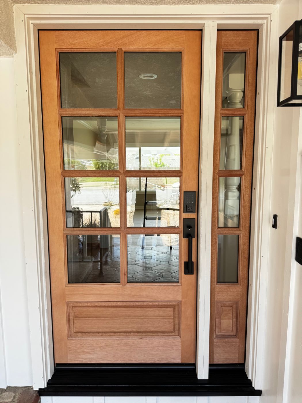 Mahogany front door with divided glass panes and matching sidelite